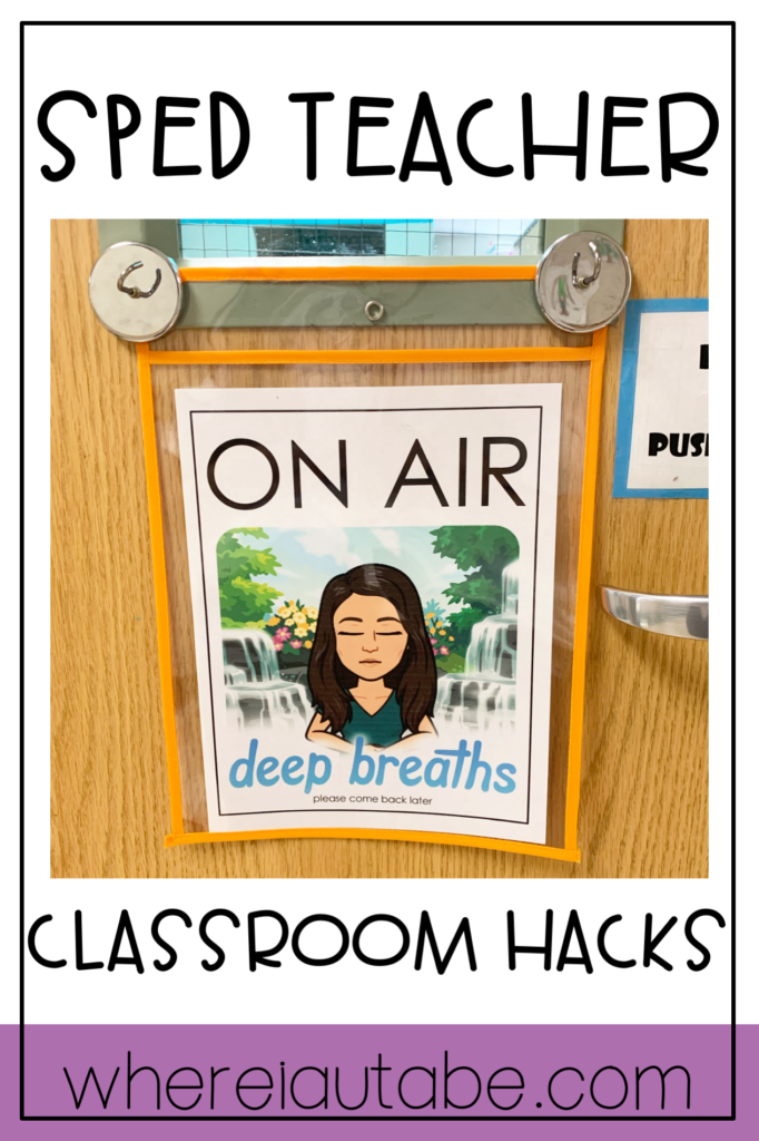 image displaying magnet hooks on a classroom door holding up a visual